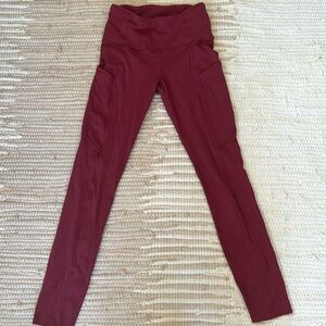 Berry colored lululemon workout leggings with pockets. Size two. Good condition